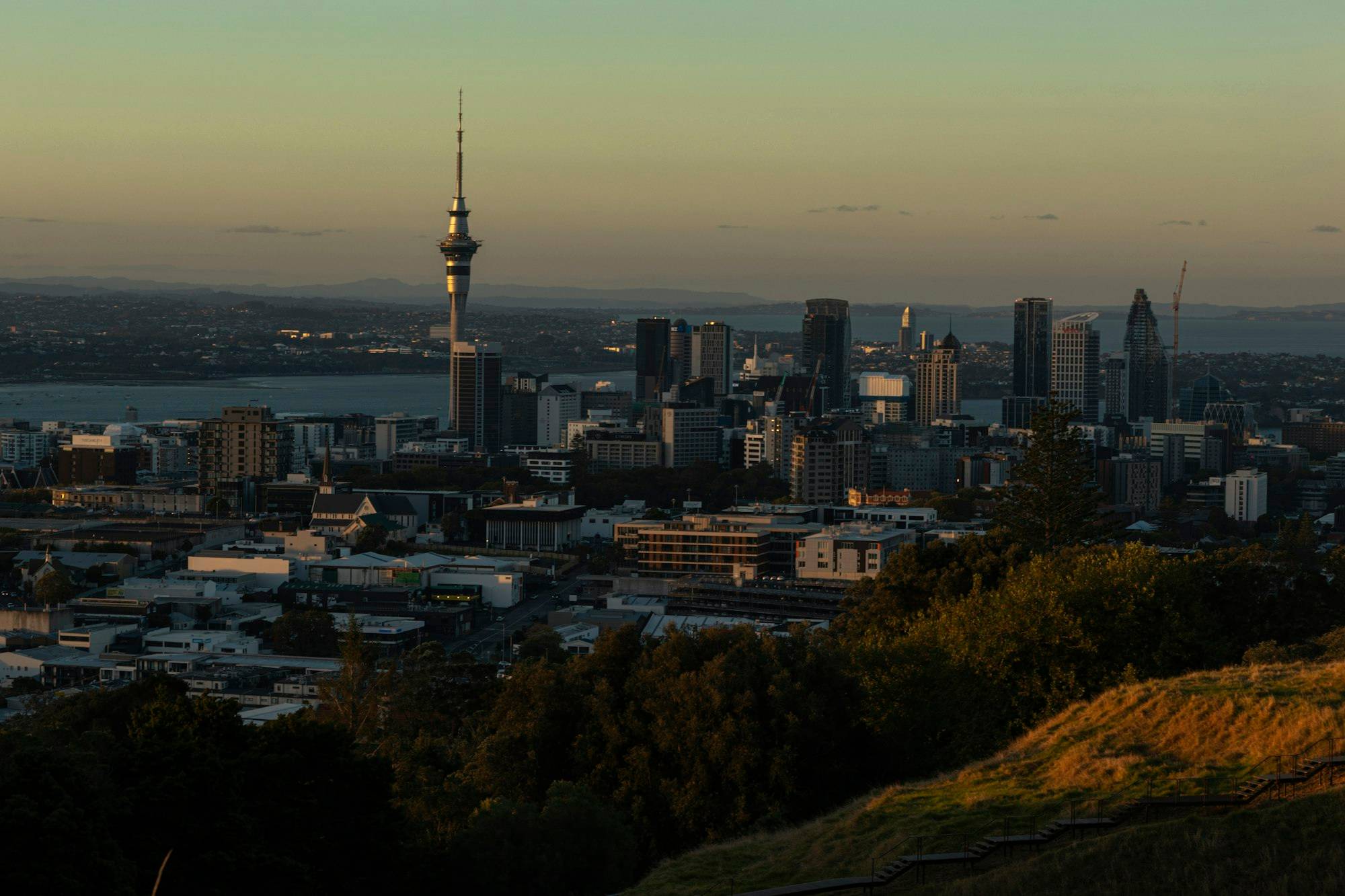 Auckland city and the Sky Tower at sunset, seen from Mount Eden
